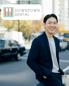 Man standing by busy street smiling